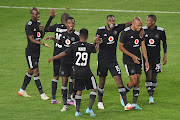 Orlando Pirates players celebrate a goal during the CAF Confederation Cup match against Royal Leopards at Orlando Stadium in March.