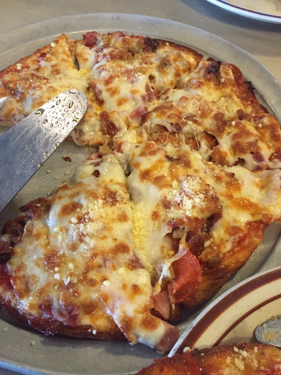 All meats pizza on gluten free crust. This is the real deal. Yum!