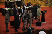 Police and security agents prevented EFF MPs storming the stage as President Cyril Ramaphosa was to deliver his state of the nation address in Cape Town. File image