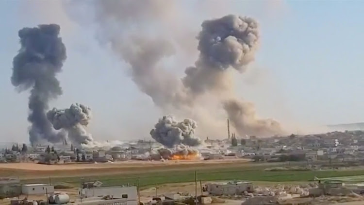 Plumes of smoke rise from a location, said to be Khan al Subul, Idlib province, Syria, targeted in a strike on May 28 2019. Picture: WHITE HELMETS VIA REUTERS