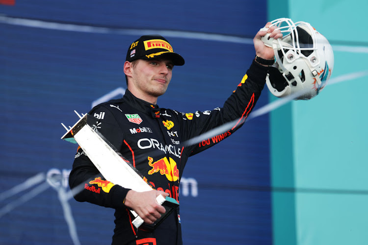 Race winner Max Verstappen celebrates on the podium during the F1 Grand Prix of Miami at the Miami International Autodrome on May 08, 2022 in Miami, Florida.