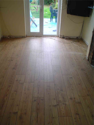 Lay Laminate flooring in Lounge and Hallway