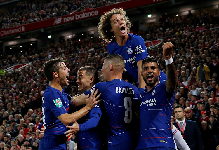 Chelsea players celebrate after scoring a goal.