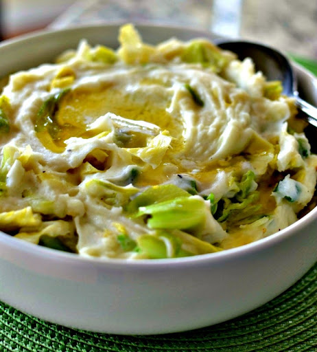 Traditional Irish Colcannon is creamy mashed potatoes mixed with sauteed cabbage and lightly seasoned with salt and pepper.  It is truly a match made in heaven.