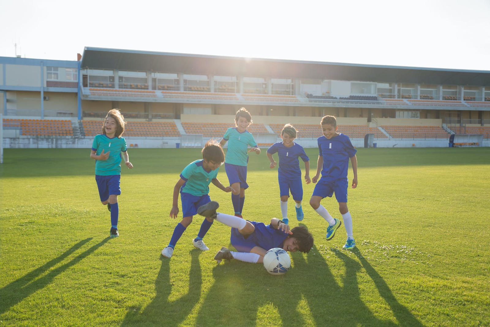 kids playing soccer outside, bonding, sports, parenting, active, healthy