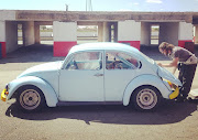 Hartzenberg tinkering with our Volkswagen Beetle at Midvaal Raceway.