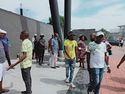 Friends and family of three women who were shot during a drive-by shooting at a crucial ANC meeting in Inanda protested outside court on Wednesday.