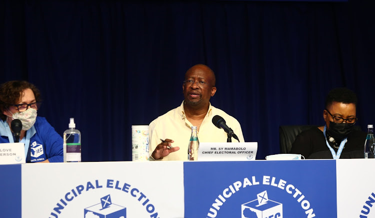 The chief electoral officer of the Electoral Commission of SA, Sy Mamabolo, flanked by vice-chair Janet Love and commissioner Nomsa Masuku. Mamabolo says the IEC wiull need an uninterrupted 18 months to prepare for credible elections in 2024.