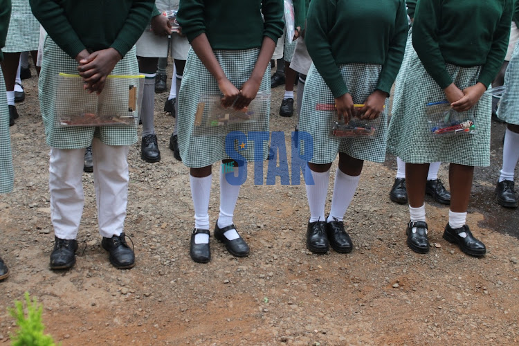 Candidates hold examination materials as they are briefed on exam rules during the start of KCPE at Westlands Primary School, Nairobi on March 22, 2021/ANDREW KASUKU