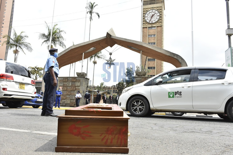 A coffin put outside Parliament by protesters.