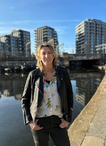 Woman standing on the edge of a canal
