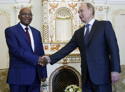 Russian President Vladimir Putin (R) shakes hands with his South African counterpart Jacob Zuma during their meeting at the Novo-Ogaryovo state residence outside Moscow, Russia. Photo credit: EPA