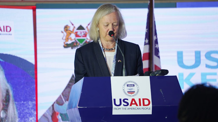 US Ambassador, Meg Whitman reads her speech during the launch of WASH high priority country plan for Kenya In Nairobi.