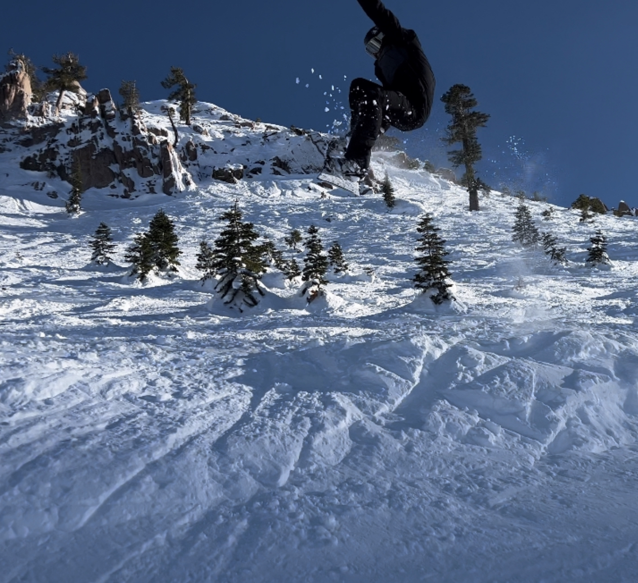 snowboarder catches air in deep snow at kt22 saddle