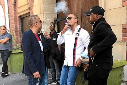 The high court in Cape Town has dismissed an appeal against being denied bail by alleged underworld boss Nafiz Modack (centre, seen here with bodyguards), his 'enforcer' and a police officer. File photo.