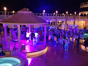 At NCL’s signature Glow party, guests wear white or neon and dance the night away to contemporary hits.