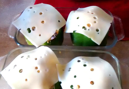 Cheesy stuffing stuffed peppers prior to baking