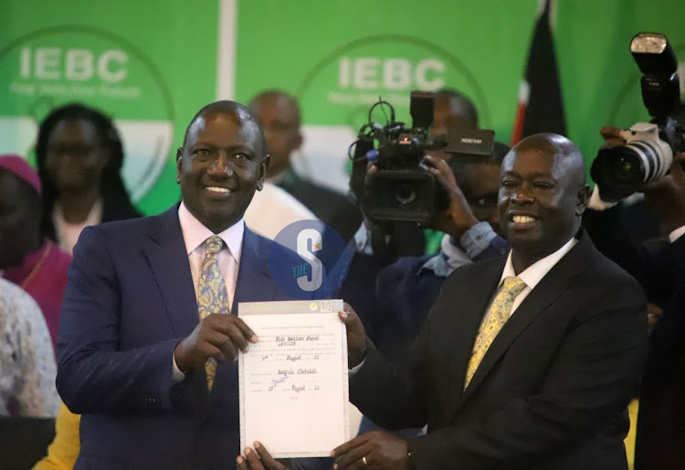 President elect William Ruto and his running mate Rigathi Gachagua hold the certificate after declaration at Bomas of Kenya on August 15, 2022