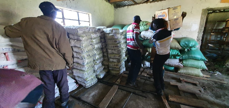 Youth store relief food in a class at Nessuit Primary School where some of the families displaced in Mau conflicts are camping. Sixteen people have been arrested in connection with the chaos that have left five people dead and scores injured.