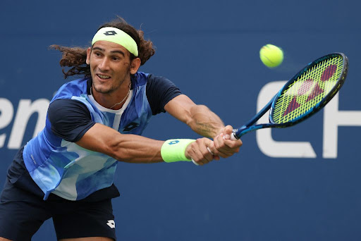 Lloyd Harris returns against Reilly Opelka of the US during their men’s singles round of 16 match at the 2021 US Open at Billie Jean King National Tennis Centre in New York on September 6 2021.