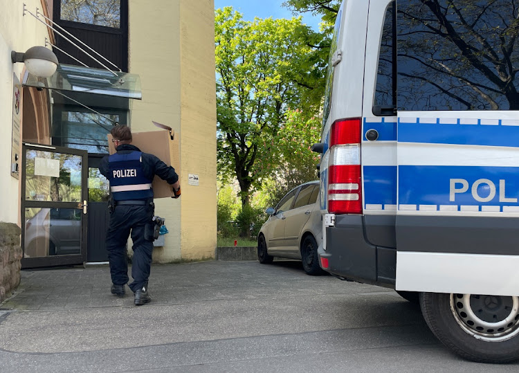 Police officers carry boxes into a police building in Mainz, Germany, May 3, 2023, after German police arrested dozens of people across the country on Wednesday in an investigation of the Italian 'Ndrangheta organised crime group, German public prosecutors and state police said. Picture: REUTERS/TIMM REICHERT