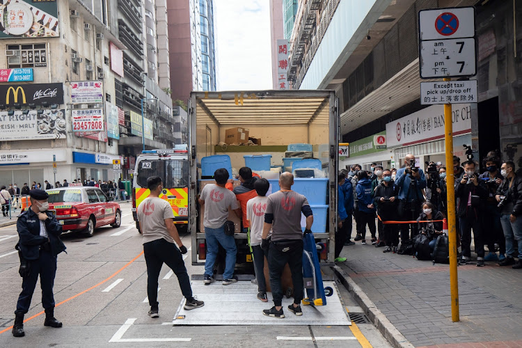 Boxes of evidence are loaded onto a truck from the offices of online media outlet Stand News during a police raid in Hong Kong, China, on Wednesday December 29 2021. Picture: BLOOMBERG/PAUL YEUNG