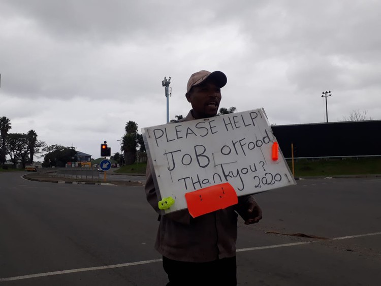 A MAN stands at the robots near Vincent Mall in East London hoping to be offered a job or something to eat. Picture: NOMBULELO DAMBA-HENDRIK