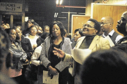 PROMISES MADE: Gauteng health department head Nomonde Xundu and financial chief Abbey Marokoane, at the back, address protesters in Johannesburg yesterday. PHOTO: BONGANI MNGUNI