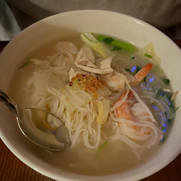 Spring Noodle Soup - spicy sour soup with noodles, chicken, shrimp, bean sprouts and green onion