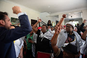 Pro-Palestinian supporters react after the judgment of the International Court of Justice (ICJ) in the Hague, at the headquarters of the Palestinian mission in Pretoria, South Africa, on January 26, 2024. 