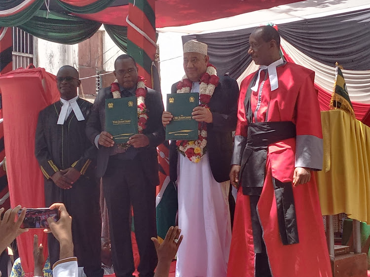 Lamu county governor elect Issa Abdalla Timamy shortly after they were sworn into office by High Court Judge Stephen Githinji at the Mkunguni Square in Lamu Island.