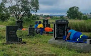 Photographs of Msunduzi municipal workers sleeping and sitting on graves were widely circulated on social media. 