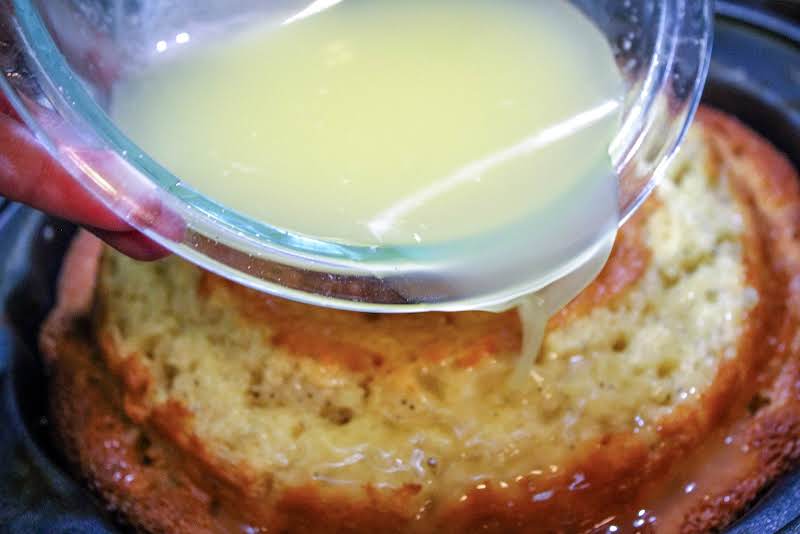 Pouring Glaze Over The Bundt Cake.