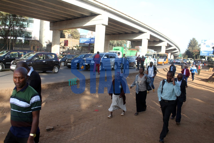 Commuters forced to walked long distances following the matatu operators strike on Thursday, May 19, 2022.