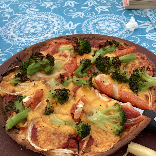 Cauliflower pizza crust with cheddar and veggies. A little overdone but tasty