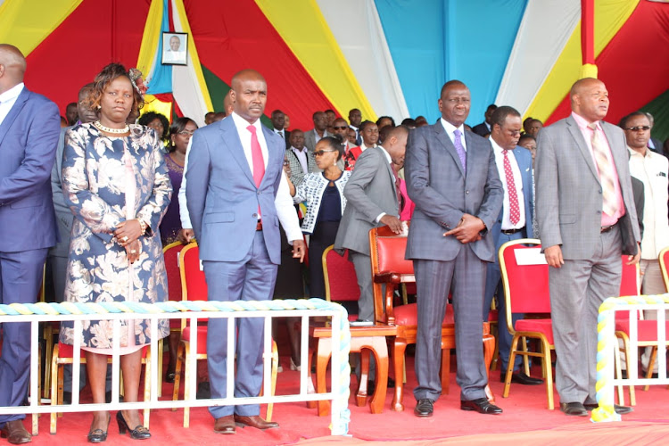 Deputy President William Ruto and other leaders during the swearing-in of Bomet Governor Hillary Barchok (centre) at the Bomet Green Stadium on August 8, 2019.