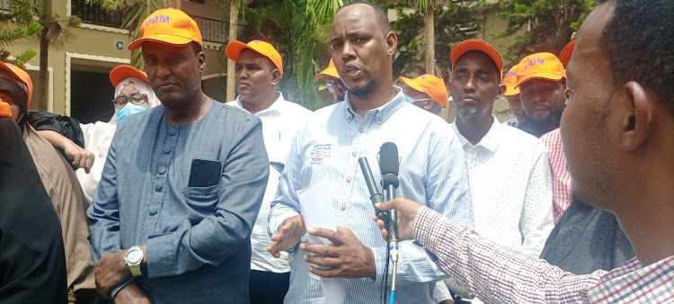 Garissa county ODM chairman Mohamed Ali addressing the press after a meeting with party officials.