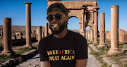 American teacher Calid Bowen sports a T-shirt reading 'Make Africa great again' in the music video for his track 'Vaycay'.