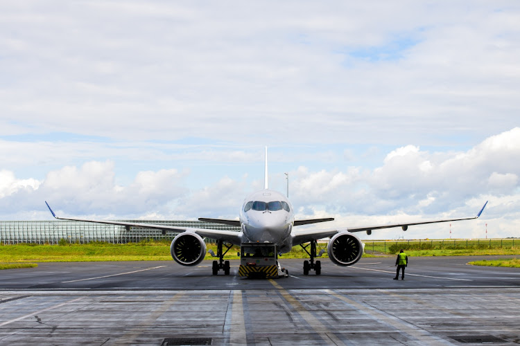 An Airbus SE A220 narrow-body passenger jet is shown on the runway at Paris Charles de Gaulle airport in Paris, France. File photo: BLOOMBERG/NATHAN LAINE