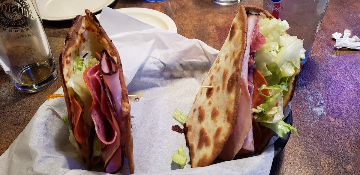 Delicious Italian cold cut flatbread. Served with a side salad.