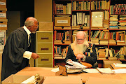 Robert  Whitehead as Belgium's King Leopold II must answer the case brought by advocate Xola Mlambo, played by John  Kani.