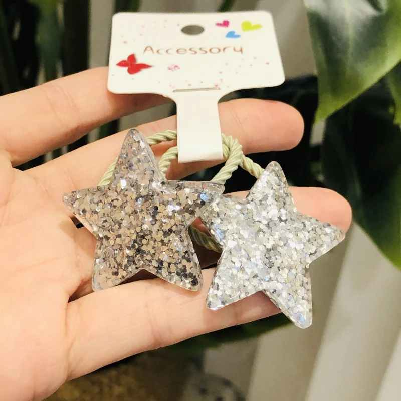 Dromerige glitter ster maan haar elastiek voor meisjes, ideaal voor speelse kapsels en een vleugje glans in het haar.