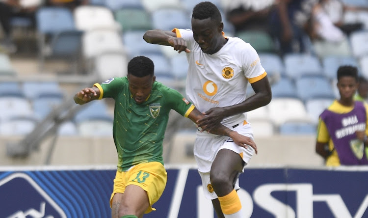 Caleb Bimenyimana of Kaizer Chiefs challenges Pule MModi of Golden Arrows during DStv Premiership match at Moses Mabhida Stadium on December 31 2022.