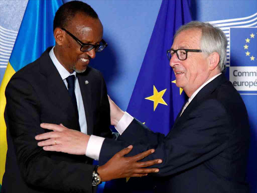 Rwanda's President Paul Kagame is greeted by European Commission President Jean-Claude Juncker ahead of a meeting at the EU Commission headquarters in Brussels, Belgium, June 4, 2018. /REUTERS