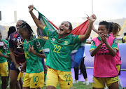 Amogelang Masego Motau and Nthabiseng Ronisha Majiya of South Africa celebrate during the 2022 Womens Africa Cup of Nations semifinal match between South Africa and Zambia.