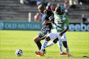 SANDWICHED: Solomon Mathe of Platinum Stars during their match against Bloemfontein Celtic yesterday  Photo: Charle Lombard/Gallo Images