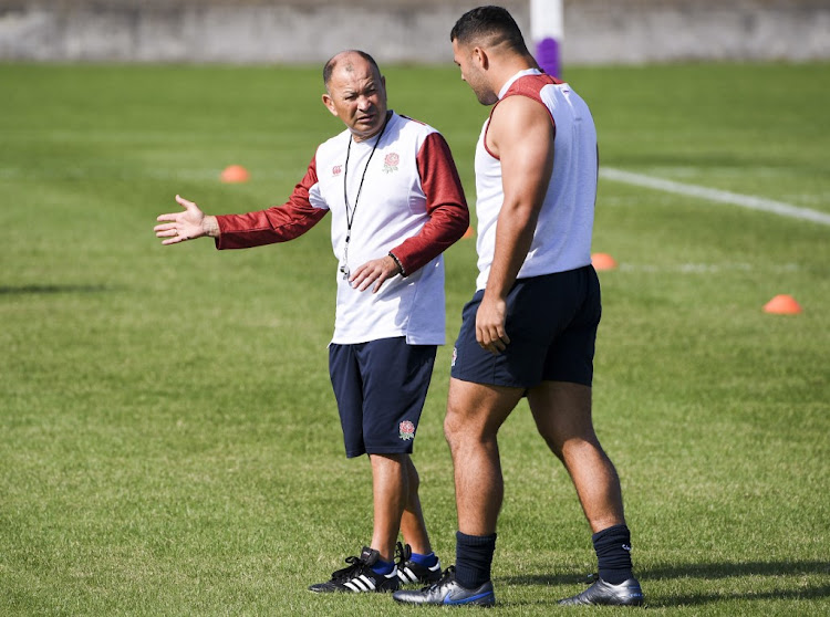 England's coach Eddie Jones (L) in a discussion with prop Ellis Genge (R) during a training session at the Japan Rugby World Cup, in Tokyo on October 9, 2019.