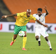 Benson Anang of Ghana and Sfiso Hlanti of South Africa during the 2022 TOTAL Africa Cup of Nations Qualifier match between South Africa and Ghana.