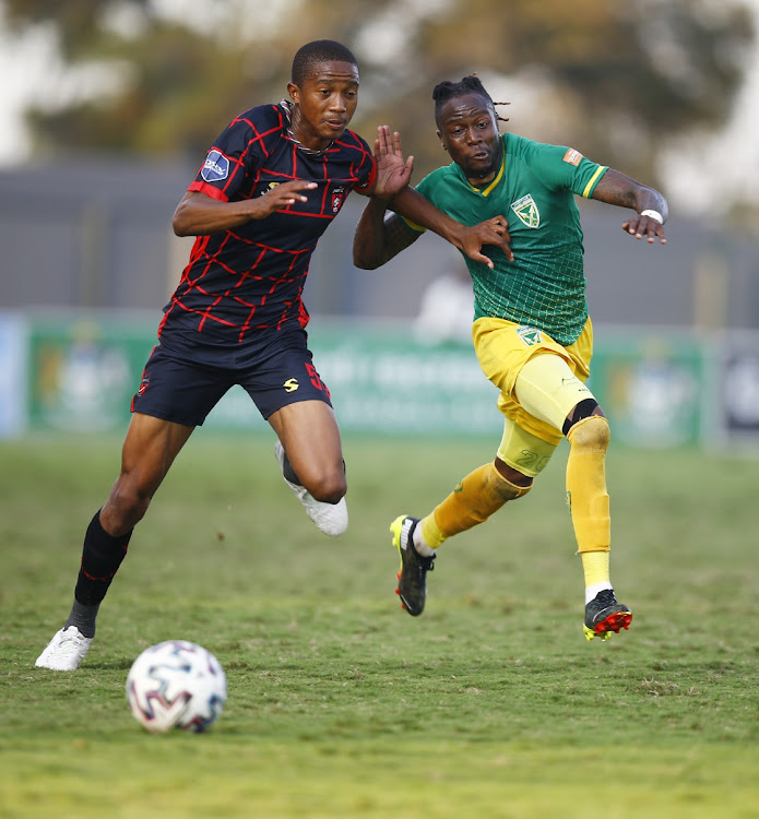 Given Msimango of TS Galaxy holds off Mthokozisi Dube of Golden Arrows during the DStv Premiership 2020/21 game between Golden Arrows and TS Galaxy at Sugar Ray Xulu Stadium.