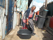 Nomishini Mone said she put big dishes and a washing basin on her bed to catch leaks throughout Thursday morning.